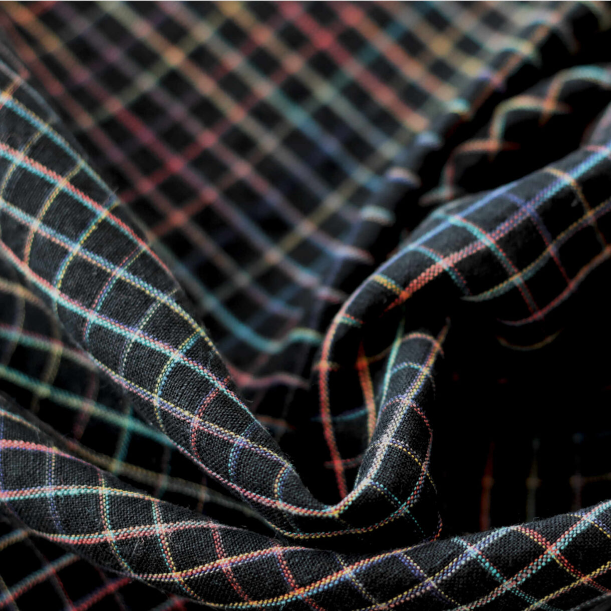 Midnight Rainbow Grids linen fabric, 160gsm with space-dyed rainbow grid lines on dark background