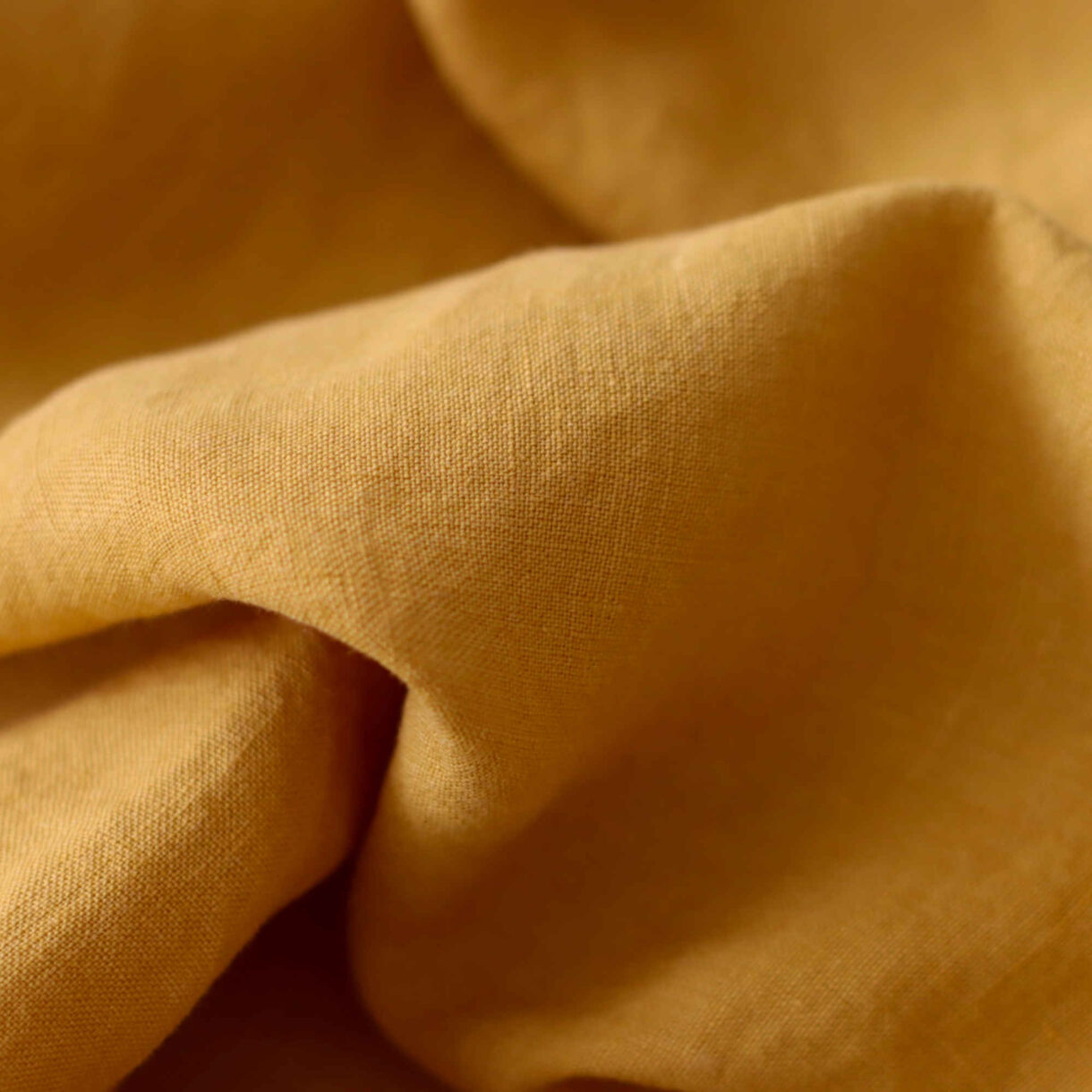 Mustard wide linen fabric with soft texture and warm golden tone, 160gsm weight