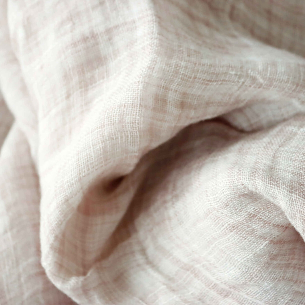 Soft gauze 100% linen fabric in Rose Mist with a semi-sheer, textured weave