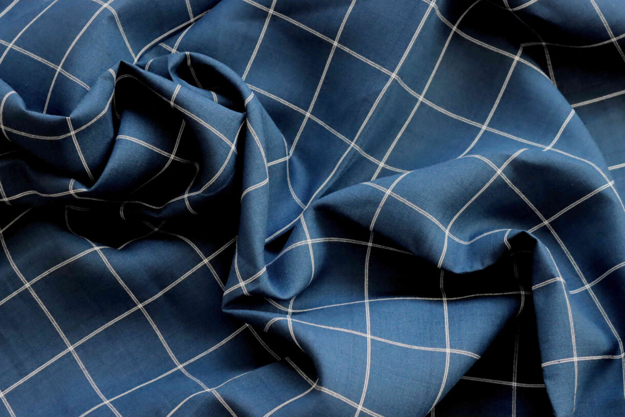 Twilight Blue Grid Linen Fabric – 160gsm Twilight Blue linen fabric with 6cm white grid pattern, 160gsm lightweight textile