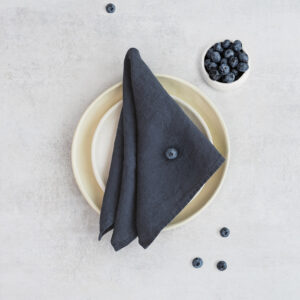 Set of two 100% linen napkins, neatly folded on a neutral table surface.