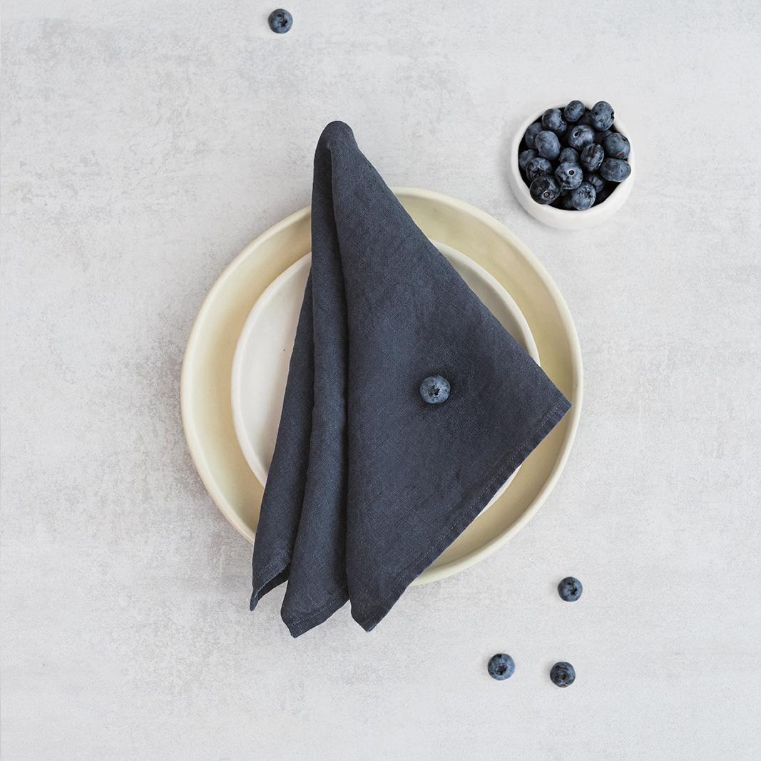 Linen napkin Midnight Blue Set of two 100% linen napkins, neatly folded on a neutral table surface.