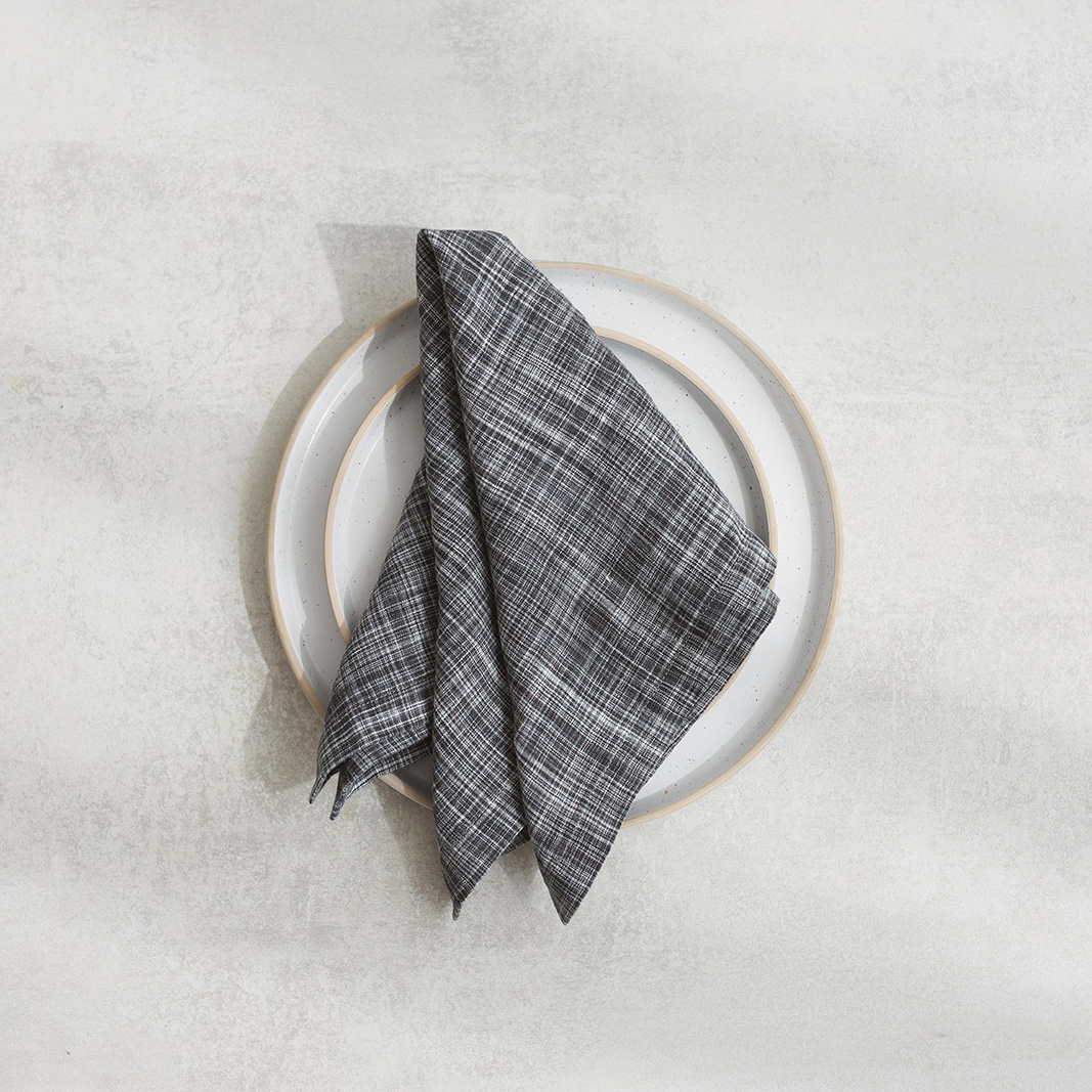 Linen napkin Grey mist Set of two 100% linen napkins, neatly folded on a neutral table surface.