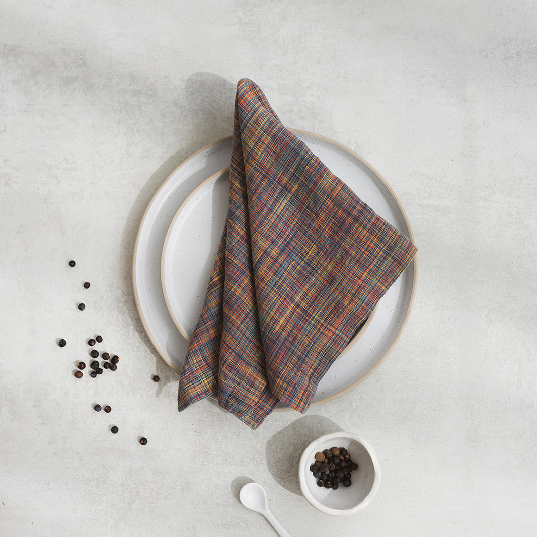 Linen napkin Rainbow Canvas Set of two 100% linen napkins, neatly folded on a neutral table surface.