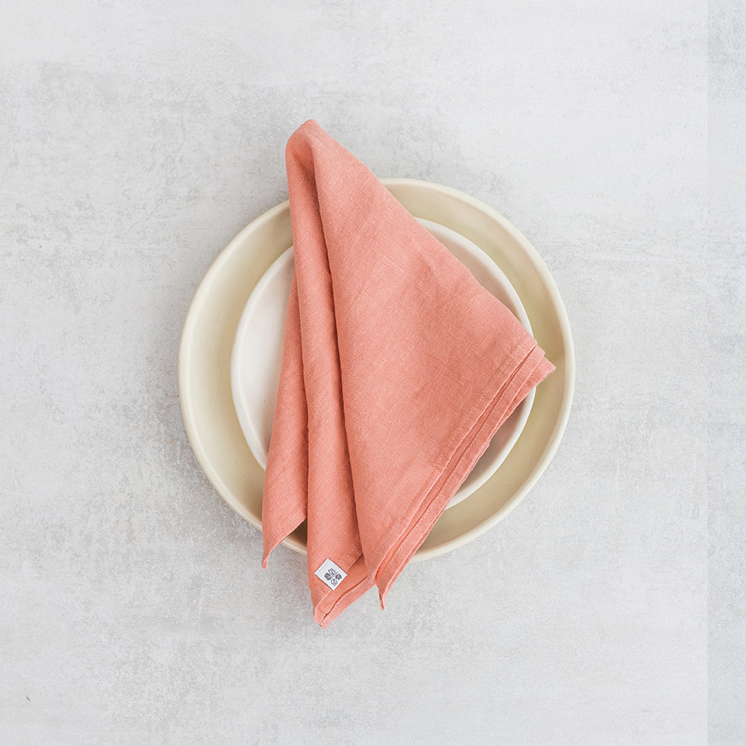 Linen napkin Soft Peach Set of two 100% linen napkins, neatly folded on a neutral table surface.
