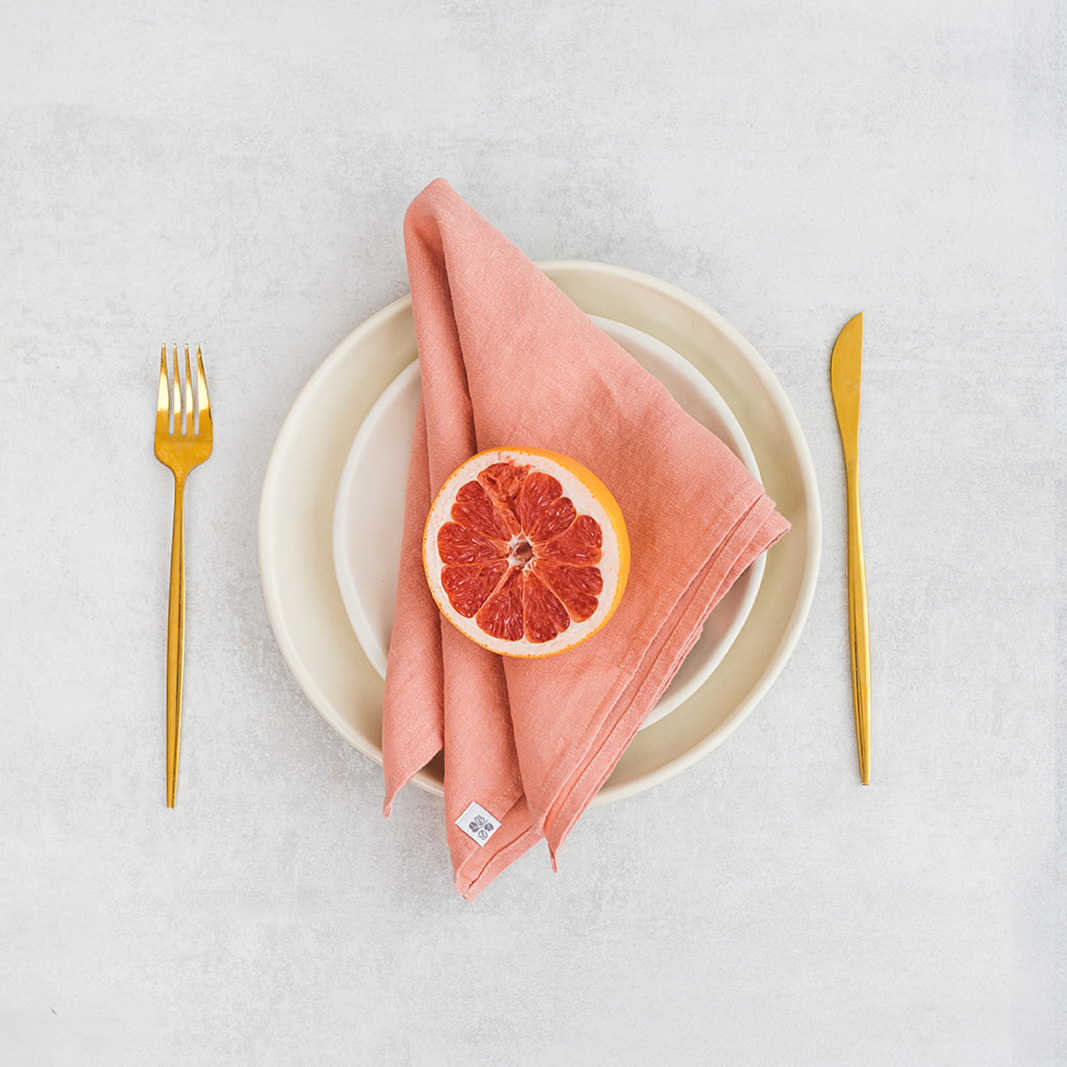 Linen napkin Soft Peach Set of two 100% linen napkins, neatly folded on a neutral table surface.